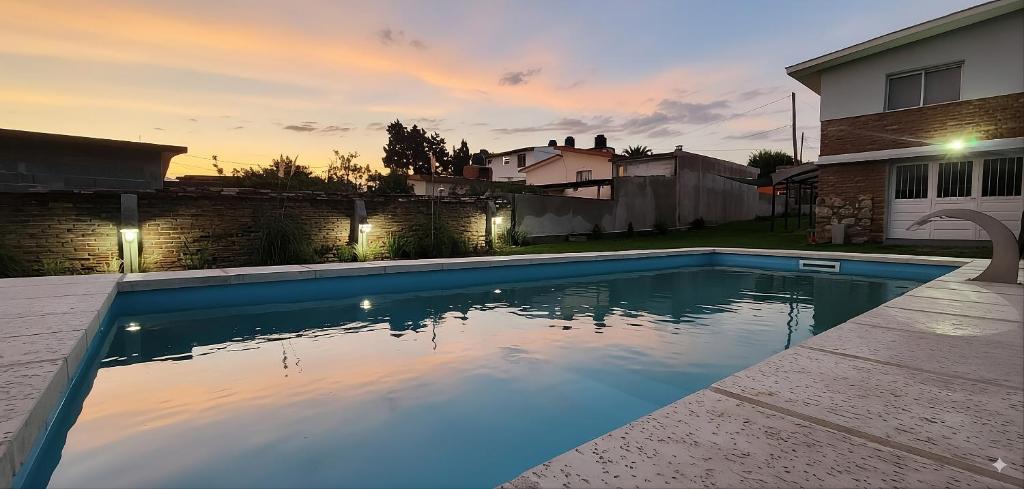 a swimming pool in the backyard of a house at El Refugio in La Falda