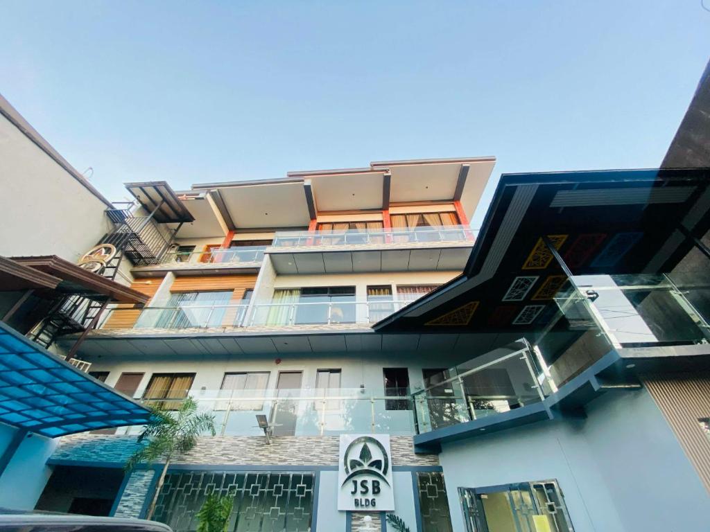 a building with balconies on the side of it at JSB Suites in Dipolog