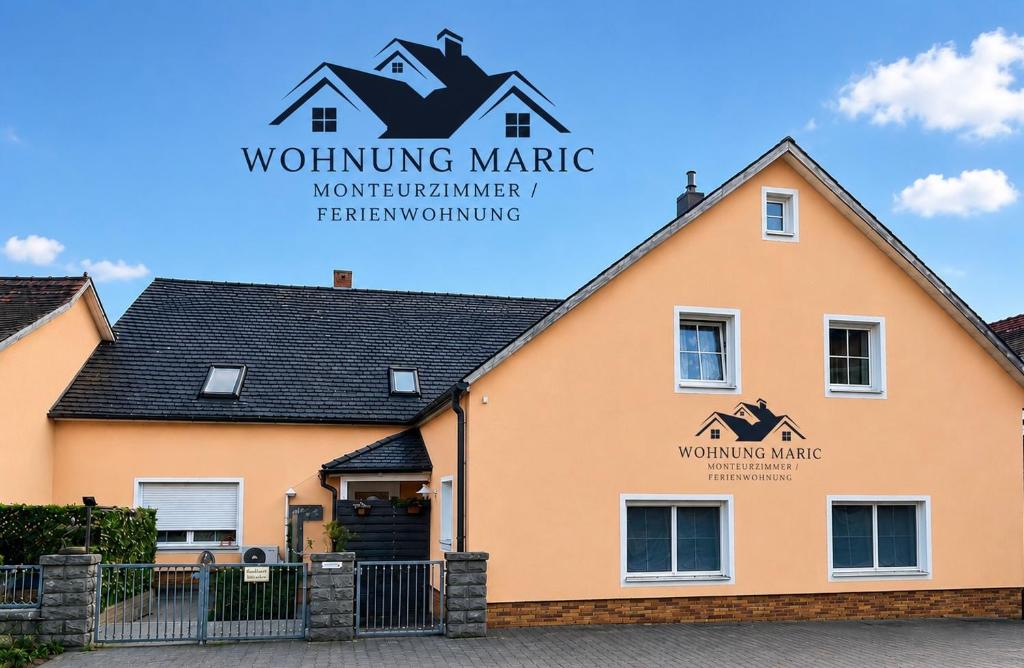 a building with the sign for wolfgang marride at Wohnung Maric bis zu 11 Personen in Neunburg vorm Wald
