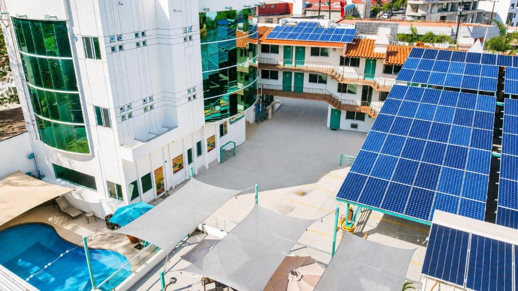 an overhead view of solar panels on the roofs of buildings at R INN de TIJUANA in Tijuana