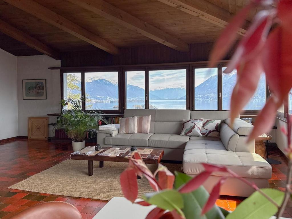 a living room with a couch and a table at La Finestra sul lago in Brissago