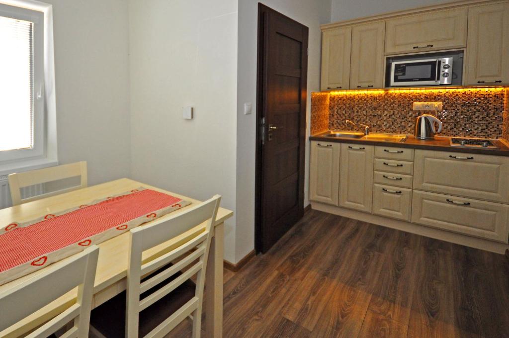 Kuchyň nebo kuchyňský kout v ubytování Apartment Bartek Ski Rental