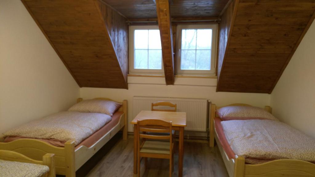 Postel nebo postele na pokoji v ubytování Podřipská Farma