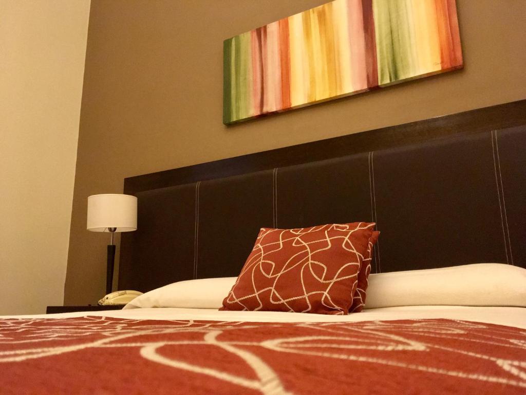 Postel nebo postele na pokoji v ubytování Hotel Premier