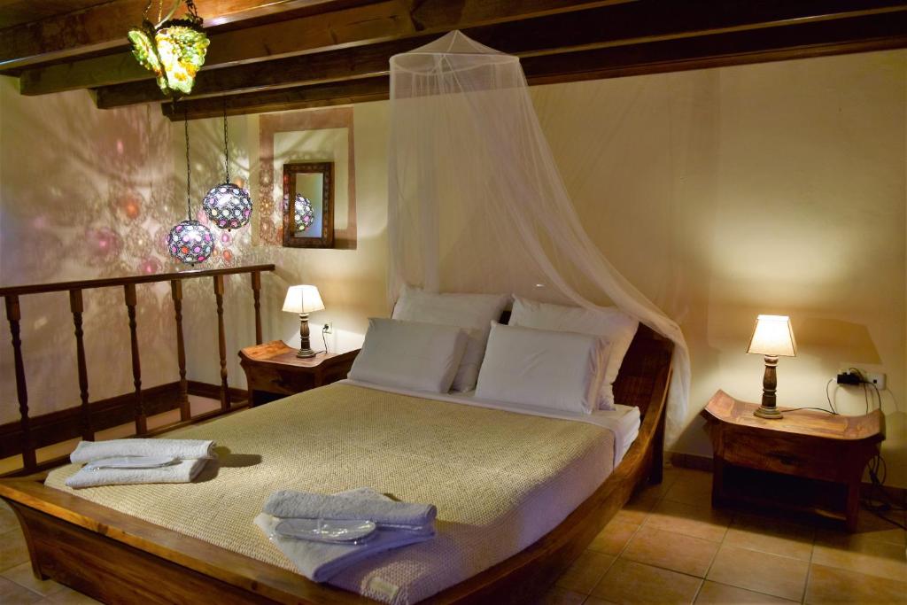 מיטה או מיטות בחדר ב-Petrino