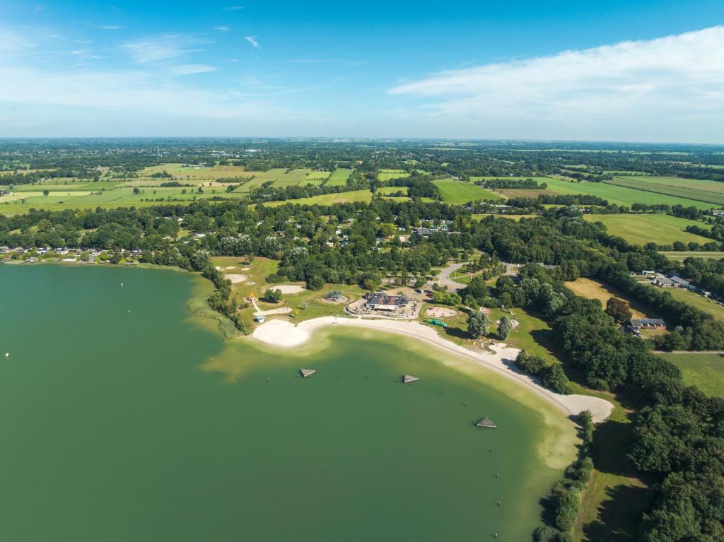 an aerial view of a island in a lake at Vakantiepark 't Strandheem in Opende