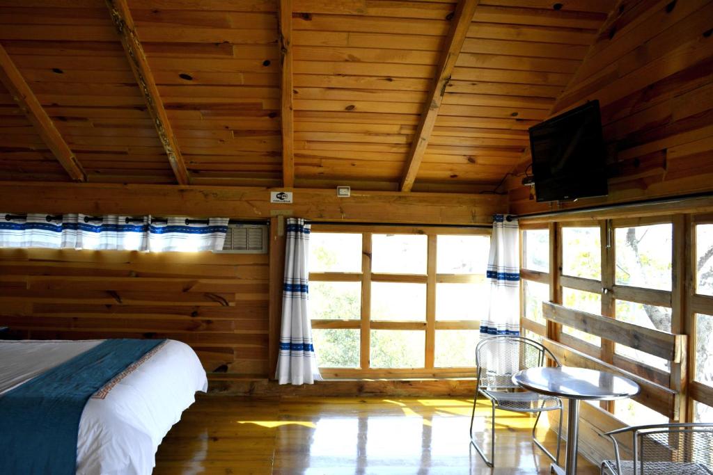 TV a/nebo společenská místnost v ubytování Cabañas el Chalet