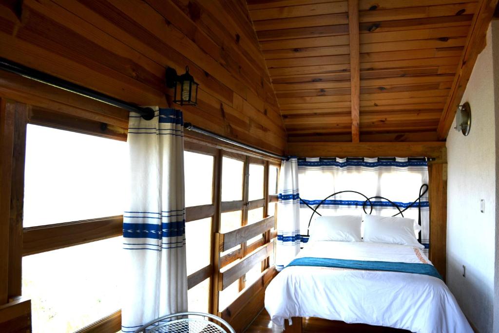 Postel nebo postele na pokoji v ubytování Cabañas el Chalet