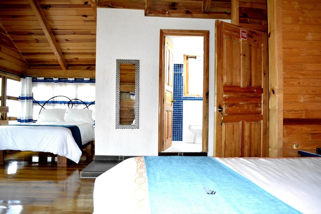 Postel nebo postele na pokoji v ubytování Cabañas el Chalet