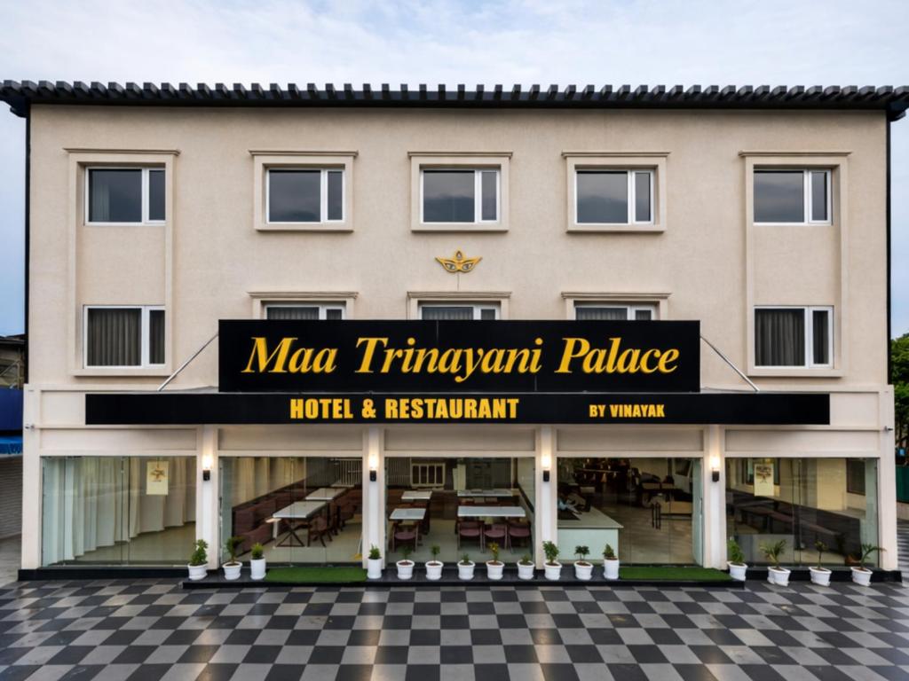 a building with a sign that reads man tramngth palace at Maa Trinayani Palace in Katra