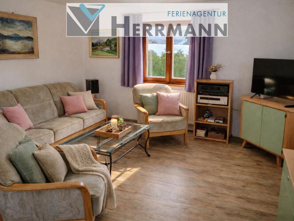 a living room with a couch and a tv at Horner Viehweid in Schwangau