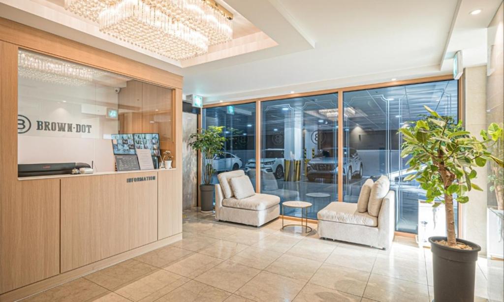 a store lobby with two chairs and a counter at BrownDot Hotel Bong-Duk in Daegu