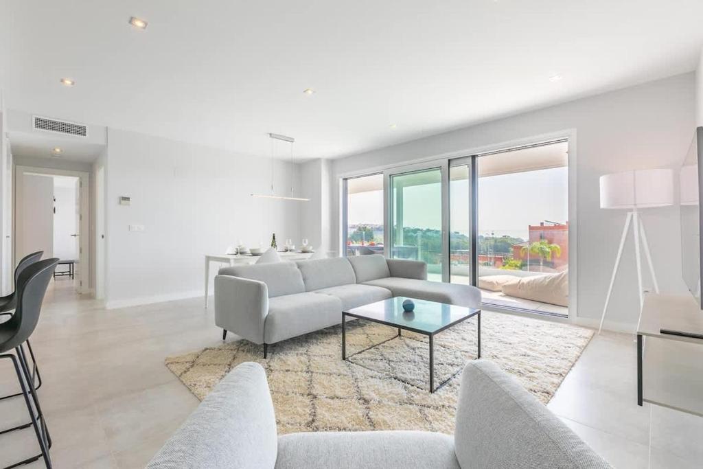 a living room with a couch and a table at Doña Julia Sea View Marvel in Casares
