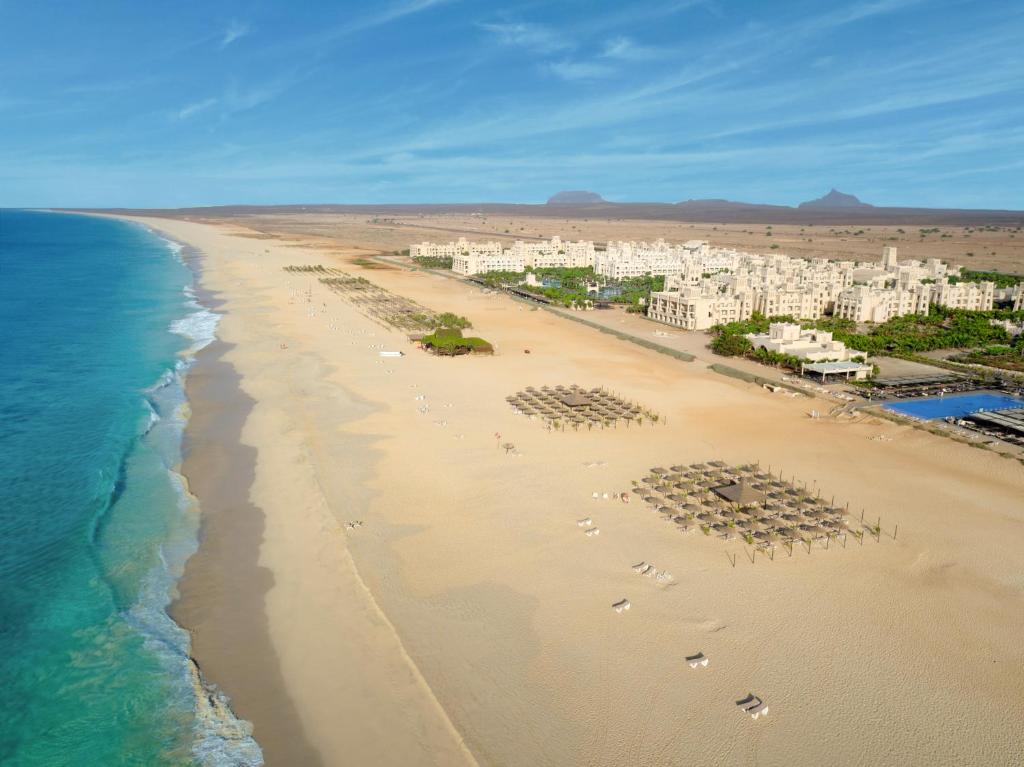 an aerial view of a beach with buildings and the ocean at Hotel Riu Touareg - All Inclusive in Curral Velho
