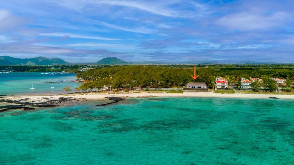 an aerial view of an island in the ocean at La Plage I Beachfront Villa on the Lagoon in Centre de Flacq