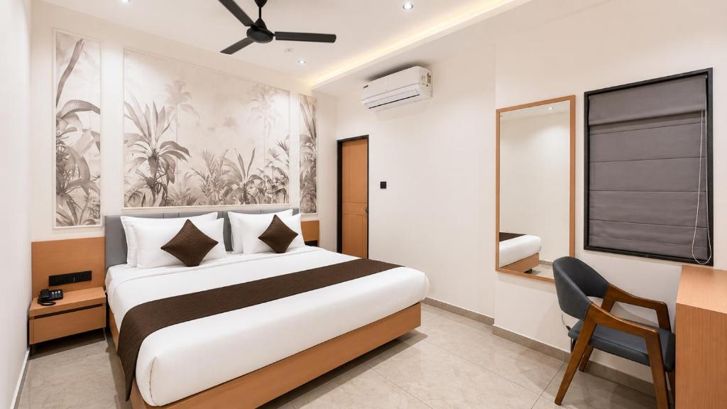 a hotel room with a bed and a window at Hotel Rushikesh inn Dwarka in Dwarka