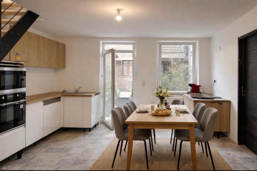a kitchen and dining room with a table and chairs at La Suite Celeste in Nuits-Saint-Georges
