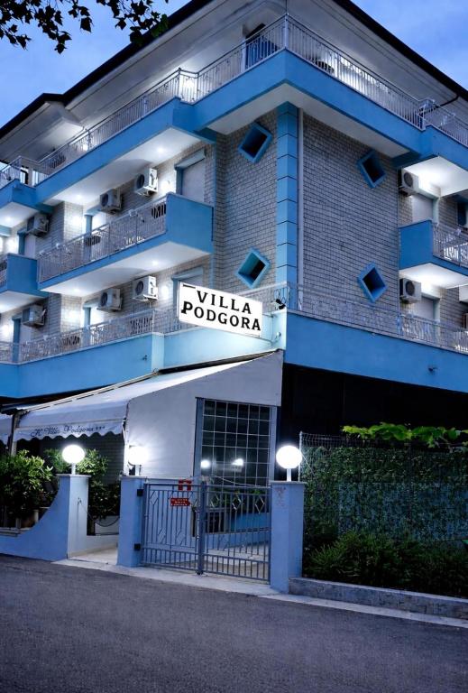 a building with a sign that reads villa pooda at Hotel Podgora Nuova Gestione in Rimini