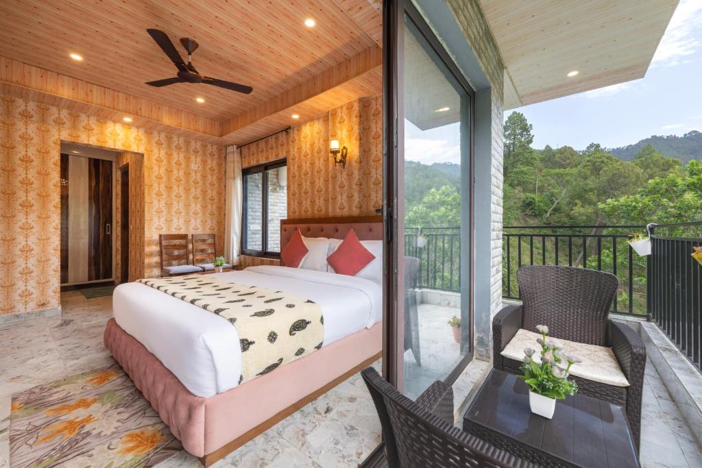 a bedroom with a bed and a balcony at A Mountains Suffer Hotel Kasauli Near Kasauli Hills Resort by Splendid Retreat Hotels - Family Groups - Balcony - Parking - Mountain View - River View - Forest Treks - Vacation - Memories in Kasauli