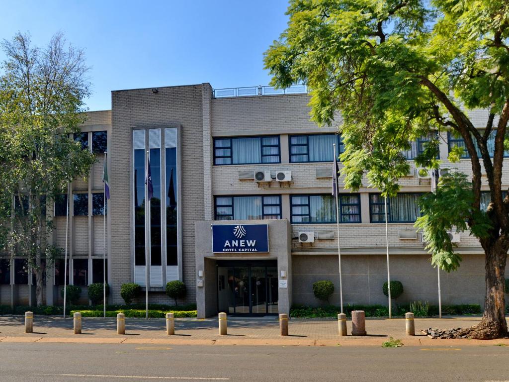 an office building with a sign that reads away at ANEW Hotel Capital Pretoria in Pretoria