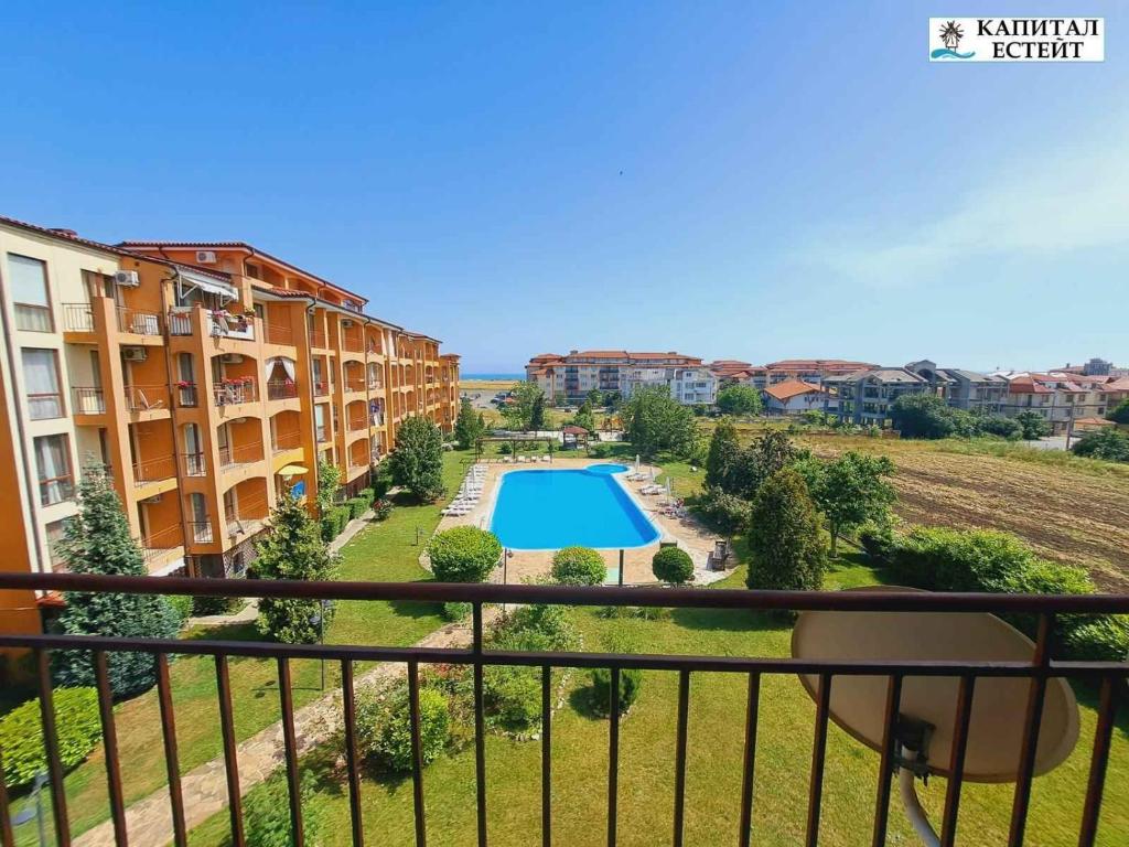 a view from the balcony of a apartment with a swimming pool at Студио Ахелой in Aheloy