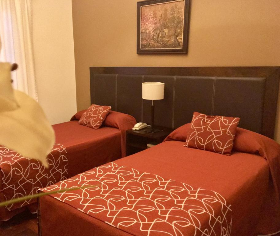 Postel nebo postele na pokoji v ubytování Hotel Premier