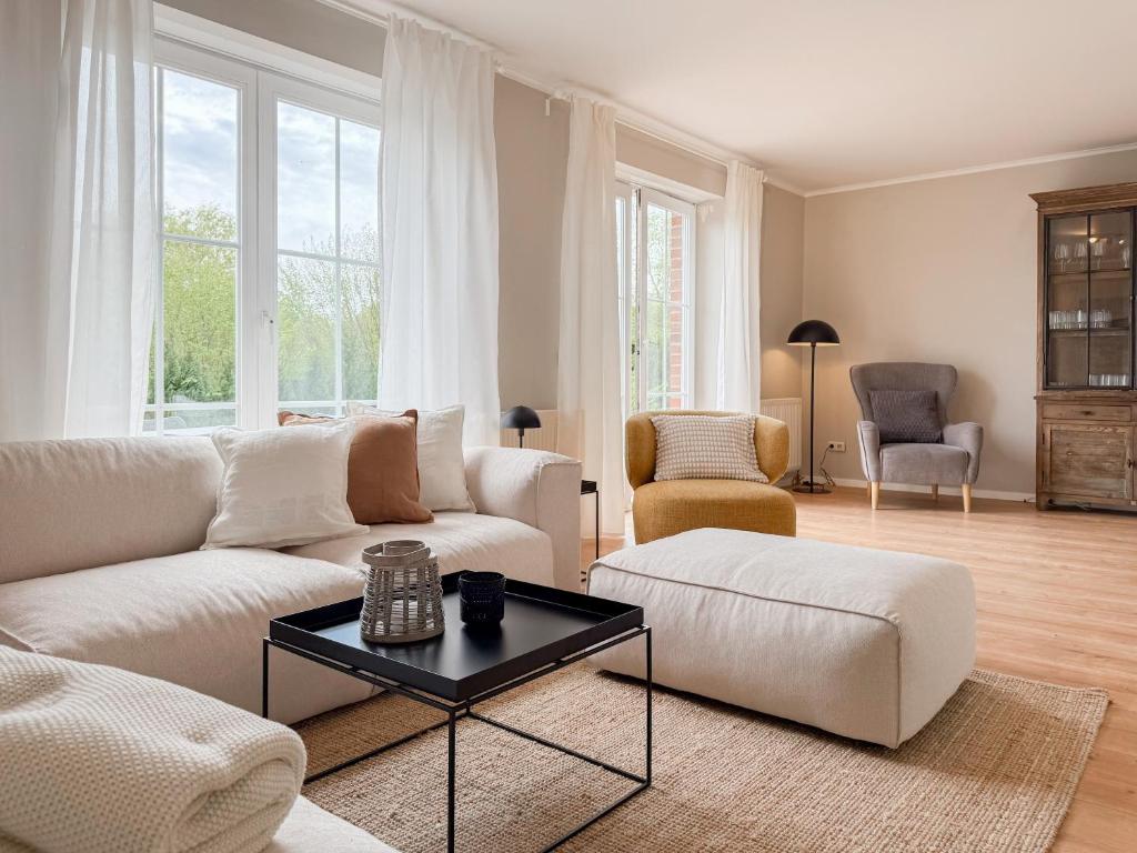 a living room with a couch and a table at Seebär in Scharbeutz