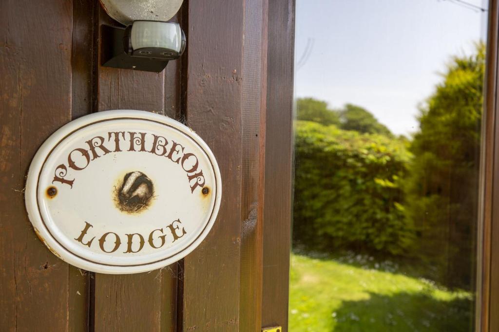 a sign on a door with a number on it at L4 - Porthbeor in Truro