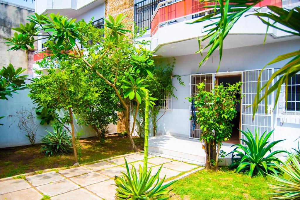 a building with trees in front of it at Guesthouse Chez Marco in Cotonou