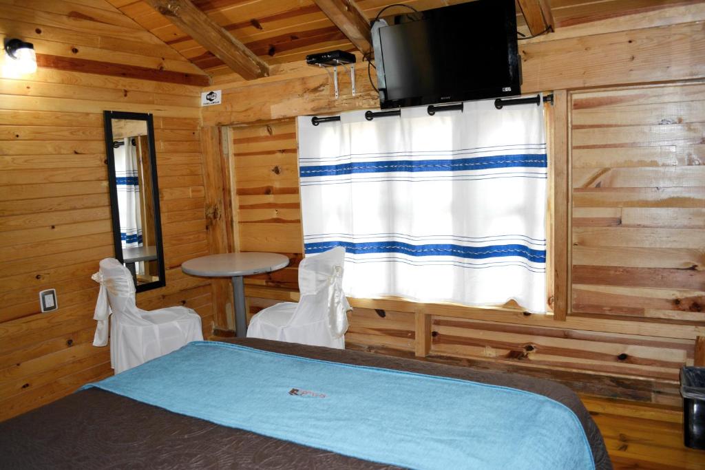 Postel nebo postele na pokoji v ubytování Cabañas el Chalet
