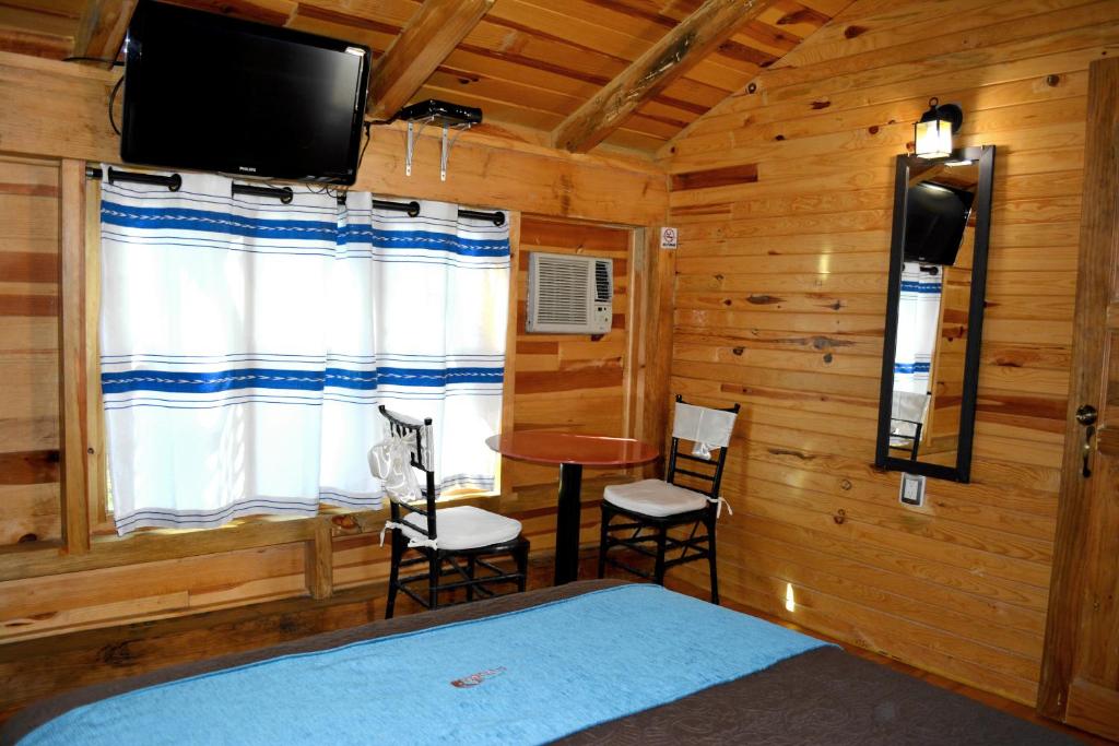 TV a/nebo společenská místnost v ubytování Cabañas el Chalet