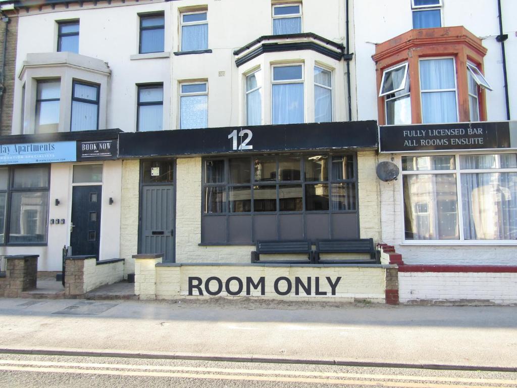 a building on a street with a room only at No Twelve in Blackpool
