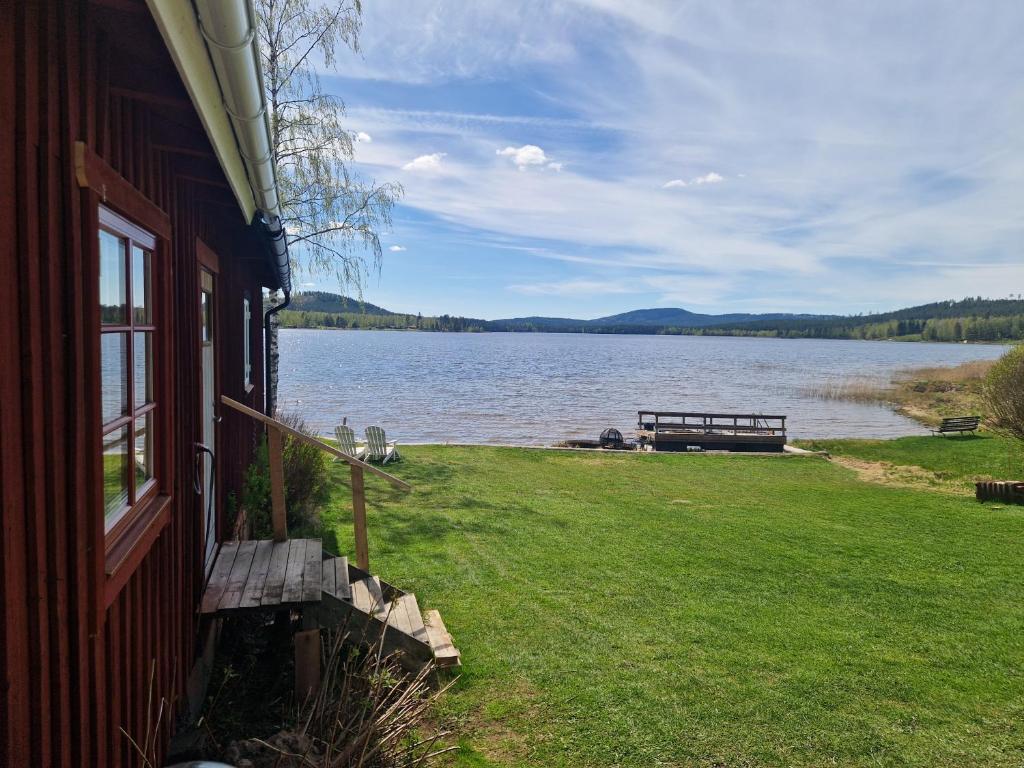 a house with a view of a large body of water at Sjöstugan in Leksand
