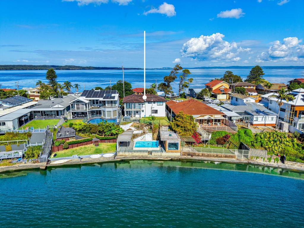an aerial view of houses and the water at Coastal Oasis in Toukley