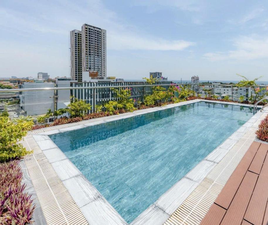 a large swimming pool on top of a building at Seasol Beach Boutique hotel in Danang