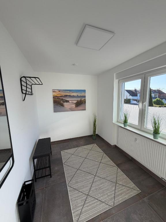 an empty living room with a basketball hoop on the wall at Ferienwohnung RaHo in Wadgassen