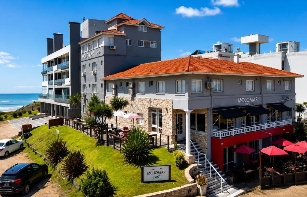 an aerial view of a hotel and the ocean at Mojomar Pinamar Hotel in Pinamar