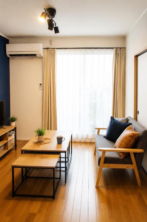 a living room with a couch and a table at 2026APR NEW Open! SETOUCHI BLUE BASE in Utazu