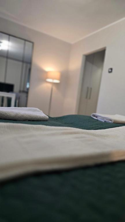 a close up of two beds in a room at Pico Bello Płock in Płock