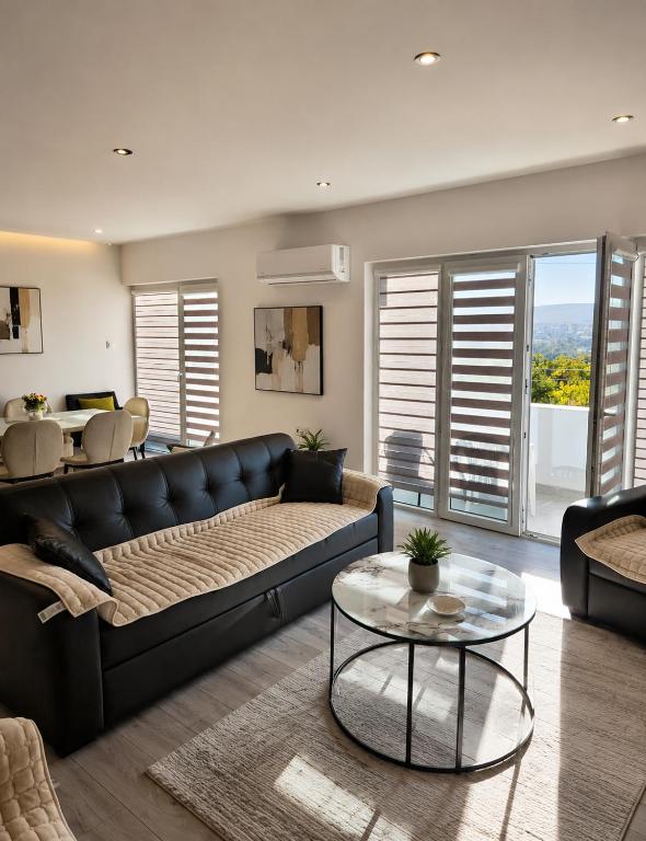 a living room with a couch and a table at Villa Milla near Autopat e 75 in Veles