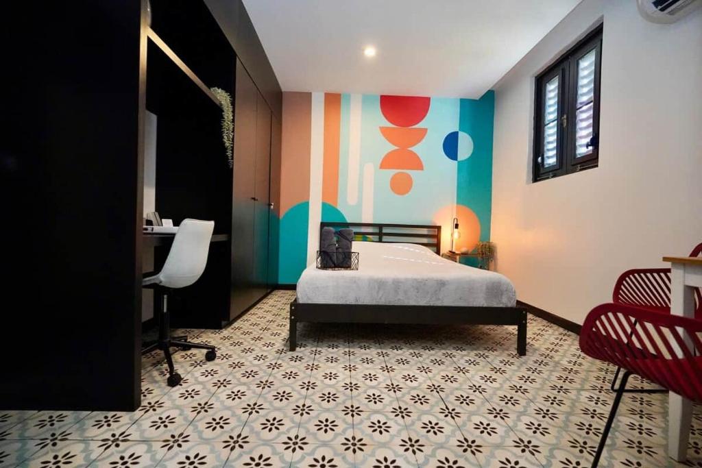 a bedroom with a bed and a desk in it at 5.5 Loft • Lobby • Generator • Parking • 2nd Floor in Mayaguez