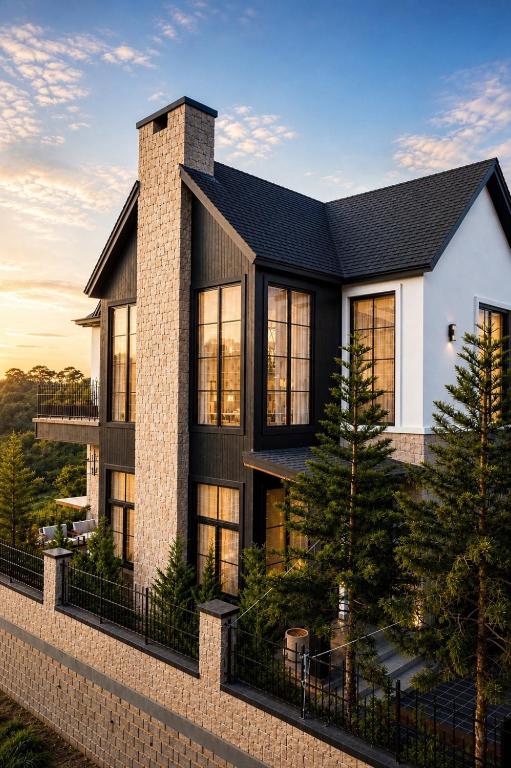 a house with a black roof at Light House Villa in Da Lat