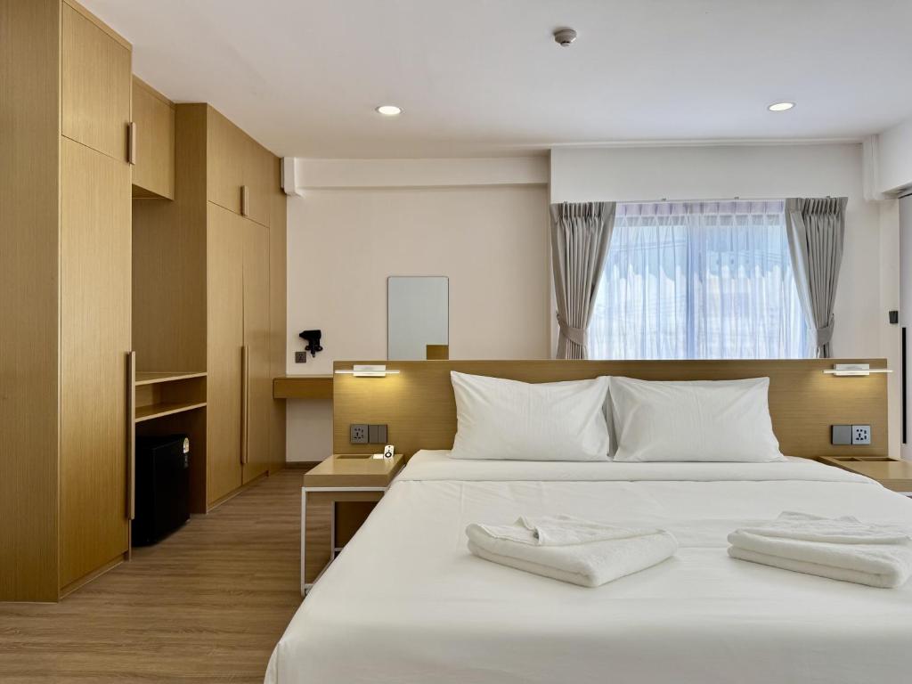 Postel nebo postele na pokoji v ubytování LIMOR hotel