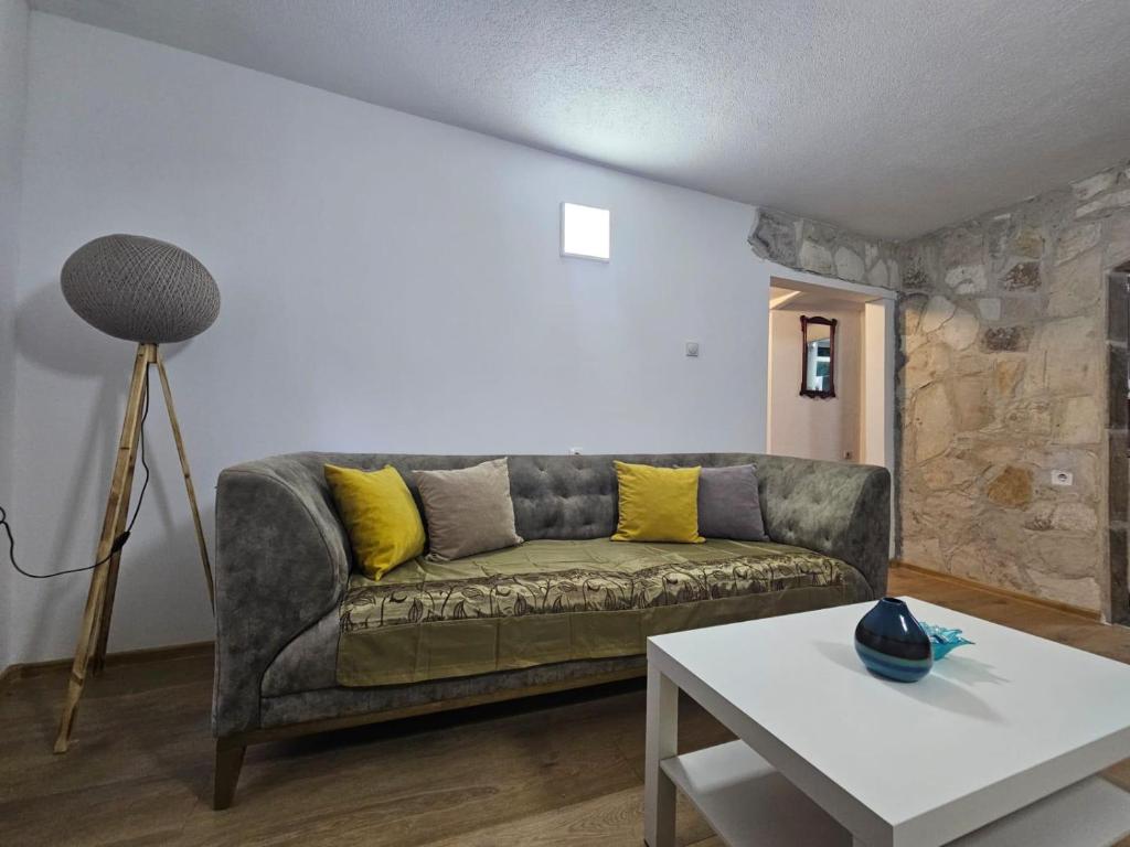 a living room with a couch and a table at Casa Di Kotor in Kotor