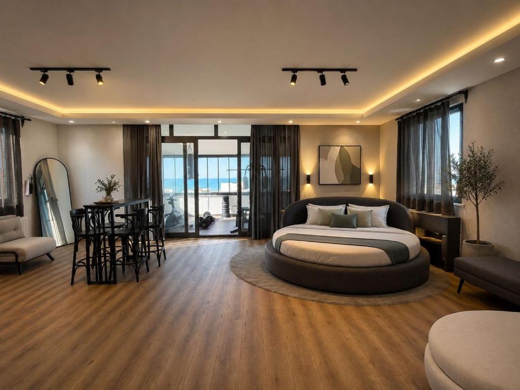a bedroom with a bed and a table and chairs at MarinaBlueGarden34 in Karaburun