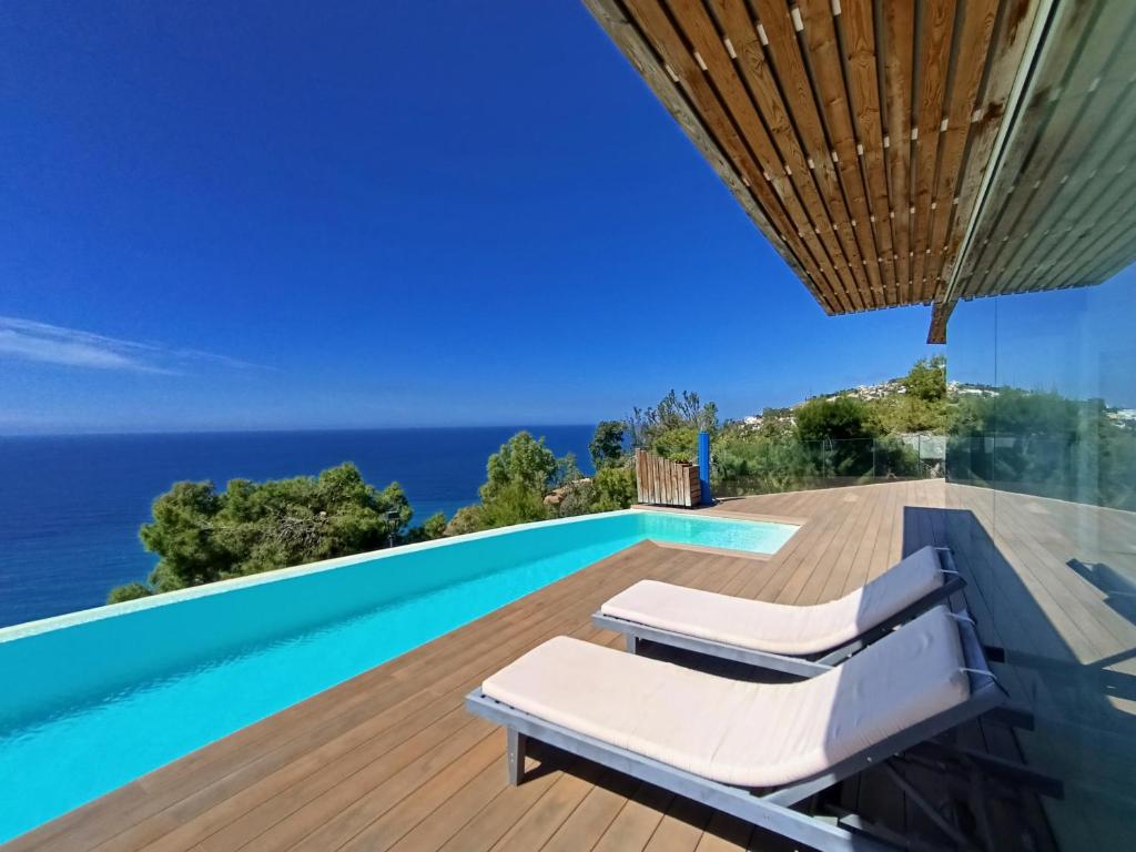 a villa with a swimming pool and a deck at Villa Luxury Paradise in Salobreña