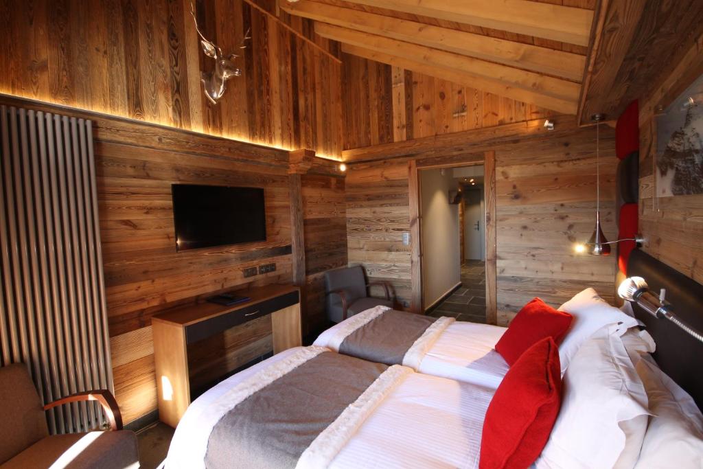 TV a/nebo společenská místnost v ubytování Hôtel Alpina & SPA - Restaurant Oxalis