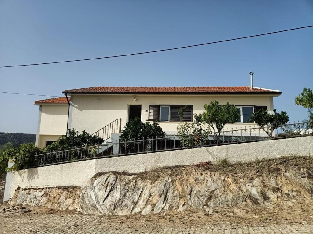 a house on top of a retaining wall at Casa da Fraga in Alfândega da Fé