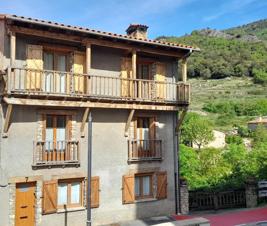 a building with balconies on the side of it at Cal Abel in Gombreny