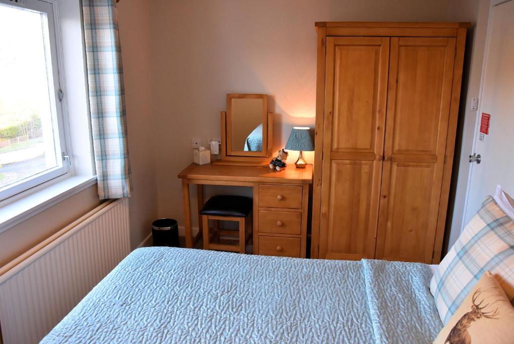 Postel nebo postele na pokoji v ubytování Lochview House